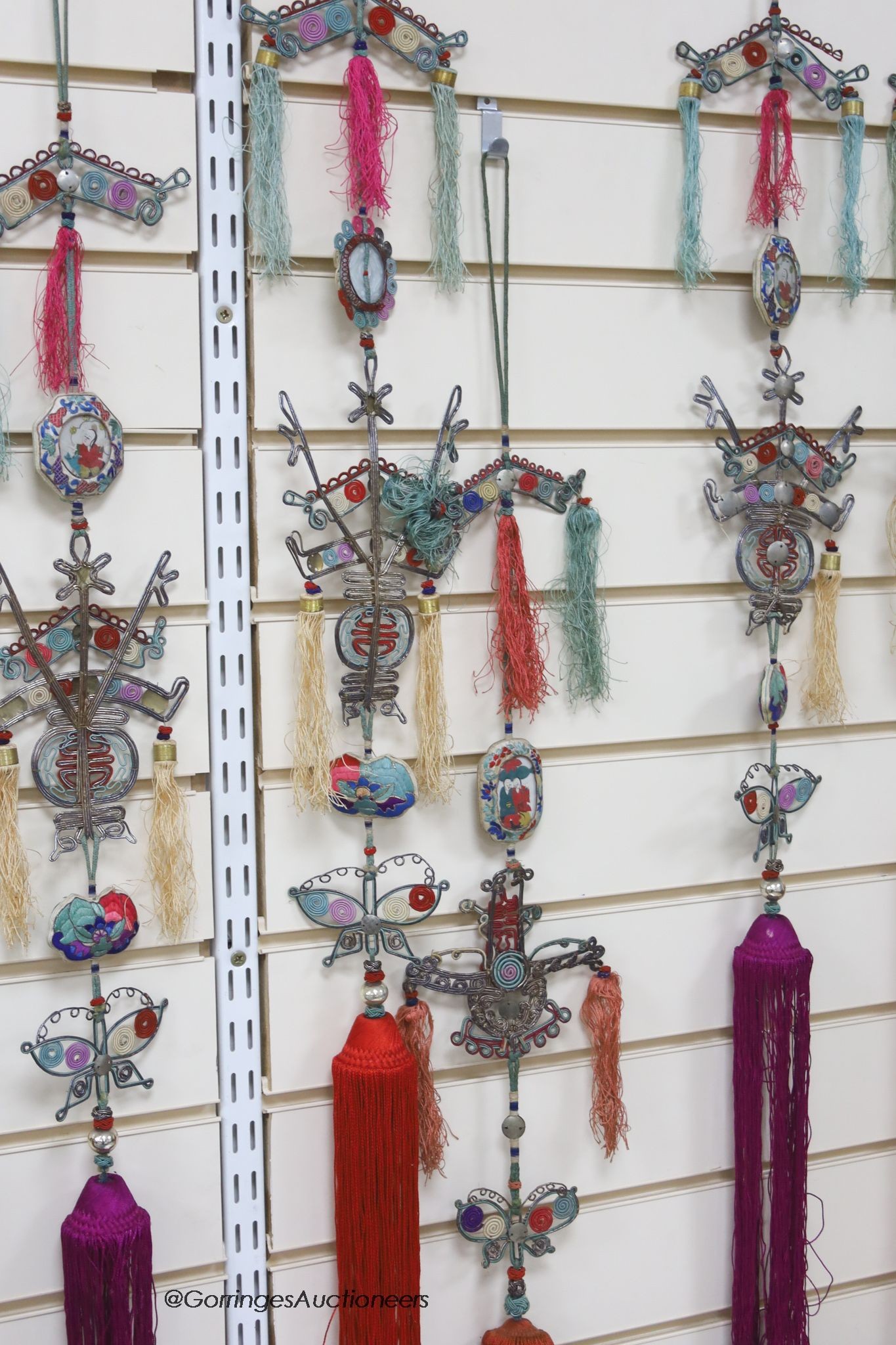 Eight 20th century Chinese embroidered, tasselled and wireworked ceremonial hangings, longest 130cm